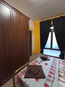 A bed or beds in a room at Casetta vacanze Gonnesa
