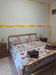 A bed or beds in a room at Casetta vacanze Gonnesa