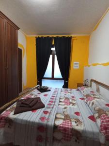 A bed or beds in a room at Casetta vacanze Gonnesa
