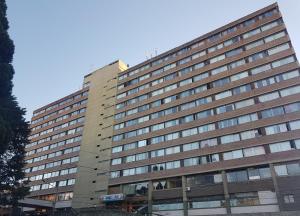 a tall building with windows on the side of it at Bariloche Studio Center Leg.1068 in San Carlos de Bariloche