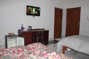 Postel nebo postele na pokoji v ubytování HOTEL BODHGAYA INN