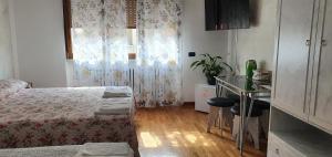 A bed or beds in a room at Le Rustiche Foresteria
