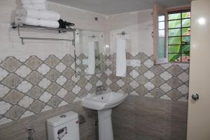 Koupelna v ubytování HOTEL BODHGAYA INN