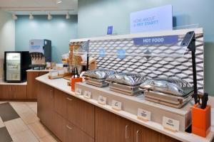 a bakery with silver trays on display in a store at Holiday Inn Express Blowing Rock South, an IHG Hotel in Blowing Rock