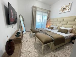 a bedroom with a large bed in a room at Private gorgeous Room with Marina view with Shared Kitchen in Dubai
