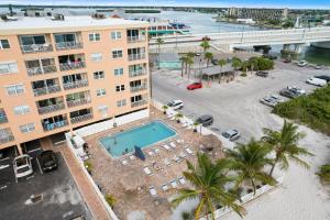 an aerial view of a hotel with a swimming pool at 108 Beach Place Condos in St Pete Beach