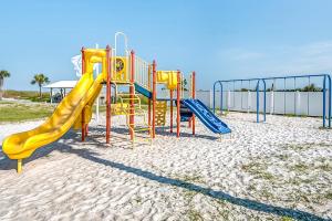 a playground with a slide on the beach at Pinnacle Port Penthouse 10 in Panama City