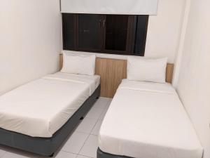 Llit o llits en una habitació de Alor Setar Imperio by IM Staycation 3bedroom & Rooftop Pool