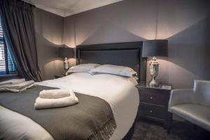 Кровать или кровати в номере N'ista Boutique Rooms Birkdale, Southport