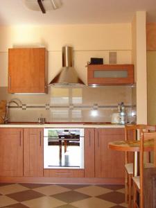 A kitchen or kitchenette at Apartamenty Krynica Zdrój