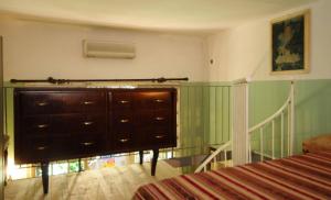 A bed or beds in a room at Residenza Branca Della Ripa