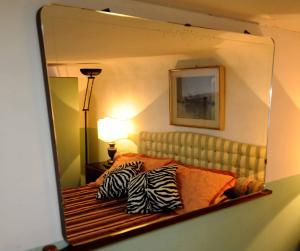 A bed or beds in a room at Residenza Branca Della Ripa