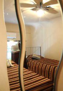 A bed or beds in a room at Residenza Branca Della Ripa