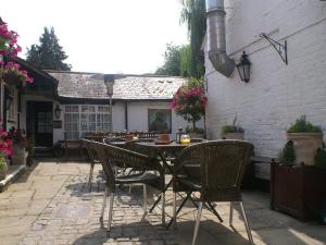 a table and chairs sitting on a patio at THE SARACENS HEAD INN in Amersham
