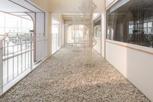 an empty hallway with a floor of rocks at YANH Ratchawat Hotel in Bangkok