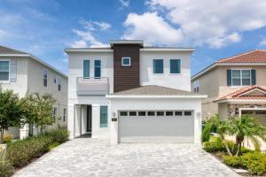 a white garage in front of a house at Encore Resort and Water Park at Reunion by Rentyl in Kissimmee