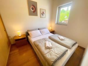 Posteľ alebo postele v izbe v ubytovaní Apartment in Crikvenica 43069