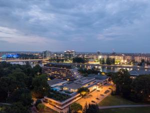 a view of a city at night with a building at Ensana Thermal Margaret Island in Budapest