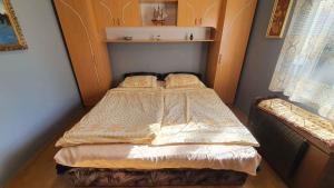 A bed or beds in a room at Holiday home in Balatonmariafürdo 43119