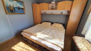 A bed or beds in a room at Holiday home in Balatonmariafürdo 43119