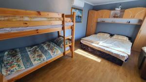 A bed or beds in a room at Holiday home in Balatonmariafürdo 43119