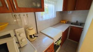 A kitchen or kitchenette at Holiday home in Balatonmariafürdo 43119