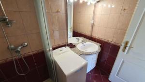 A bathroom at Holiday home in Balatonmariafürdo 43119