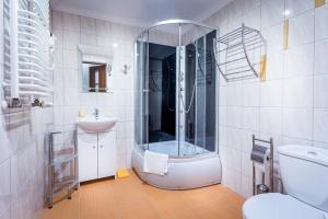 Vonios kambarys apgyvendinimo įstaigoje Magnat Inn & Sauna & Relax