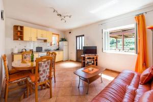 a living room with a couch and a table at House Marina in Rogačić