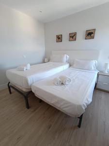 Łóżko lub łóżka w pokoju w obiekcie weforyou Two Rooms Terramar Alto with Sea View