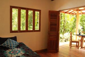 Säng eller sängar i ett rum på Finca Ardilla Jungle Lodge