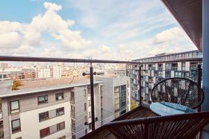 a balcony with a view of a city at Deluxe City Apt, River Canal View& Free Parking! in Leeds