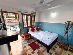 Kama o mga kama sa kuwarto sa R&R Guest House
