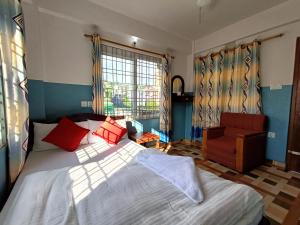 Kama o mga kama sa kuwarto sa R&R Guest House