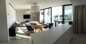 A television and/or entertainment centre at New apartment in Higueron West