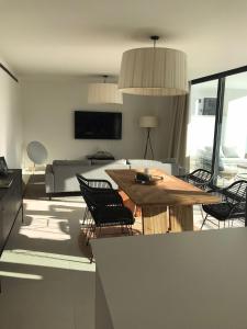 A television and/or entertainment centre at New apartment in Higueron West
