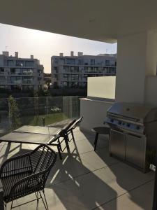 A balcony or terrace at New apartment in Higueron West