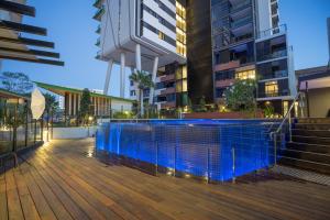 a swimming pool in the middle of a building at Arena Apartments by CLLIX in Brisbane
