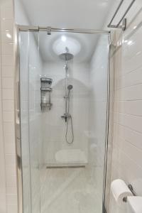 a shower with a glass door in a bathroom at Malibú Mogán Casita Bonsai - Wifi & Beach Studio in Puerto de Mogán +31 photos