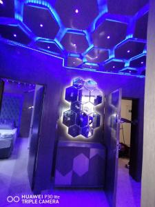 a bathroom with purple lights on the ceiling at Ap 2ch city centre parking en face Hilton a cote du plage in Tangier