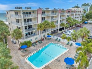 an aerial view of the resort with a pool and palm trees at Holiday Villas 2 104 in Clearwater Beach