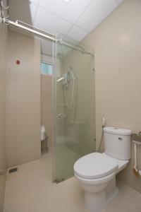 a bathroom with a toilet and a glass shower at Căn Hộ Nghỉ Dưỡng Melody Vũng Tàu - Tomorrow HomeStay 3 in Vung Tau