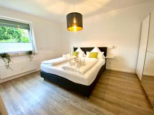 a bedroom with a large bed and a window at Willinger Perle 69 in Willingen