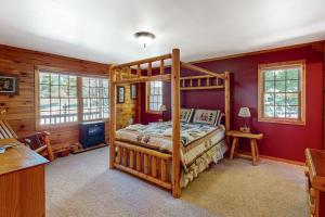 a bedroom with a bunk bed in a cabin at Ridge Wood in Empire