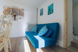 Posezení v ubytování Una Civetta sul Lago