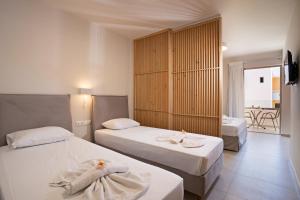 Posteľ alebo postele v izbe v ubytovaní Hotel Kathrin Beach