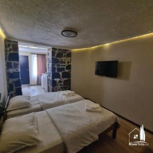 Voodi või voodid majutusasutuse River House Boutique Hotel toas