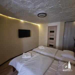Voodi või voodid majutusasutuse River House Boutique Hotel toas