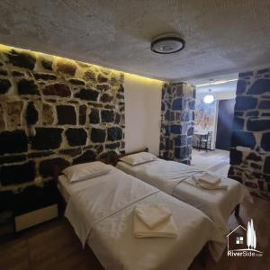 Voodi või voodid majutusasutuse River House Boutique Hotel toas