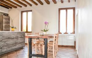 a kitchen and dining room with a table and chairs at Beautiful Home In Saulchery With Wifi in Saulchery